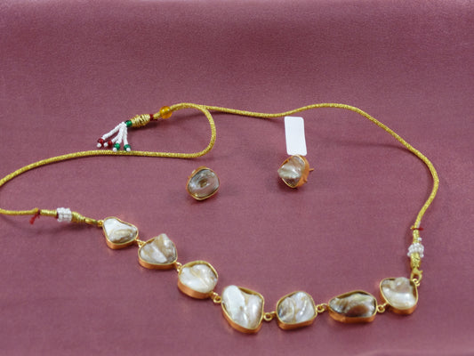 Dharani Pearl beaded Stone